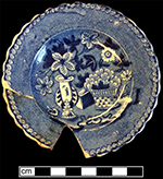 Printed underglaze pearlware cup plate with background fill of field dots.  Field dots had a period of peak production between 1816 and 1841. Rim diameter: 4.12” - from 18BC33.